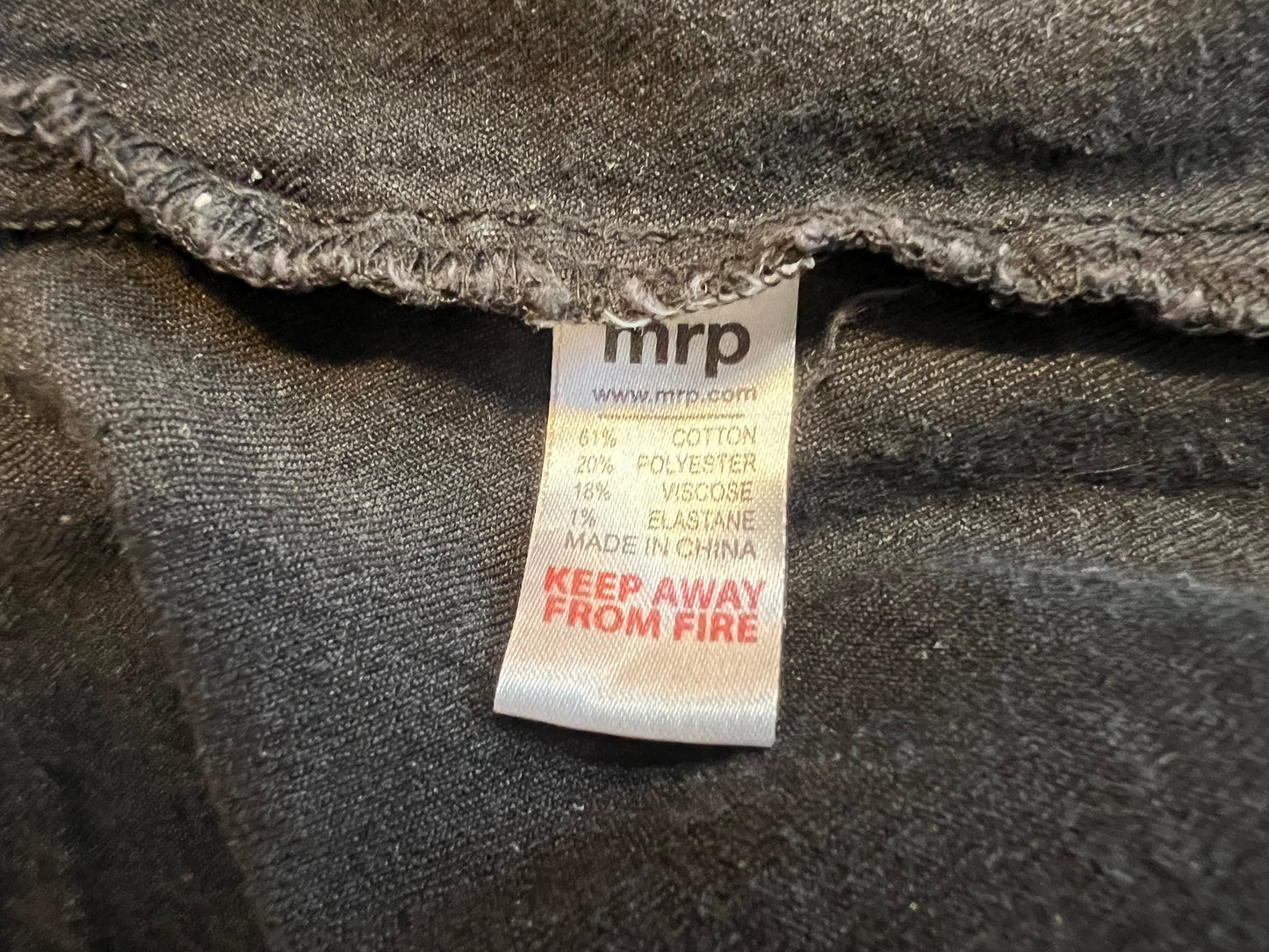 Black denim jacket with blue denim patch