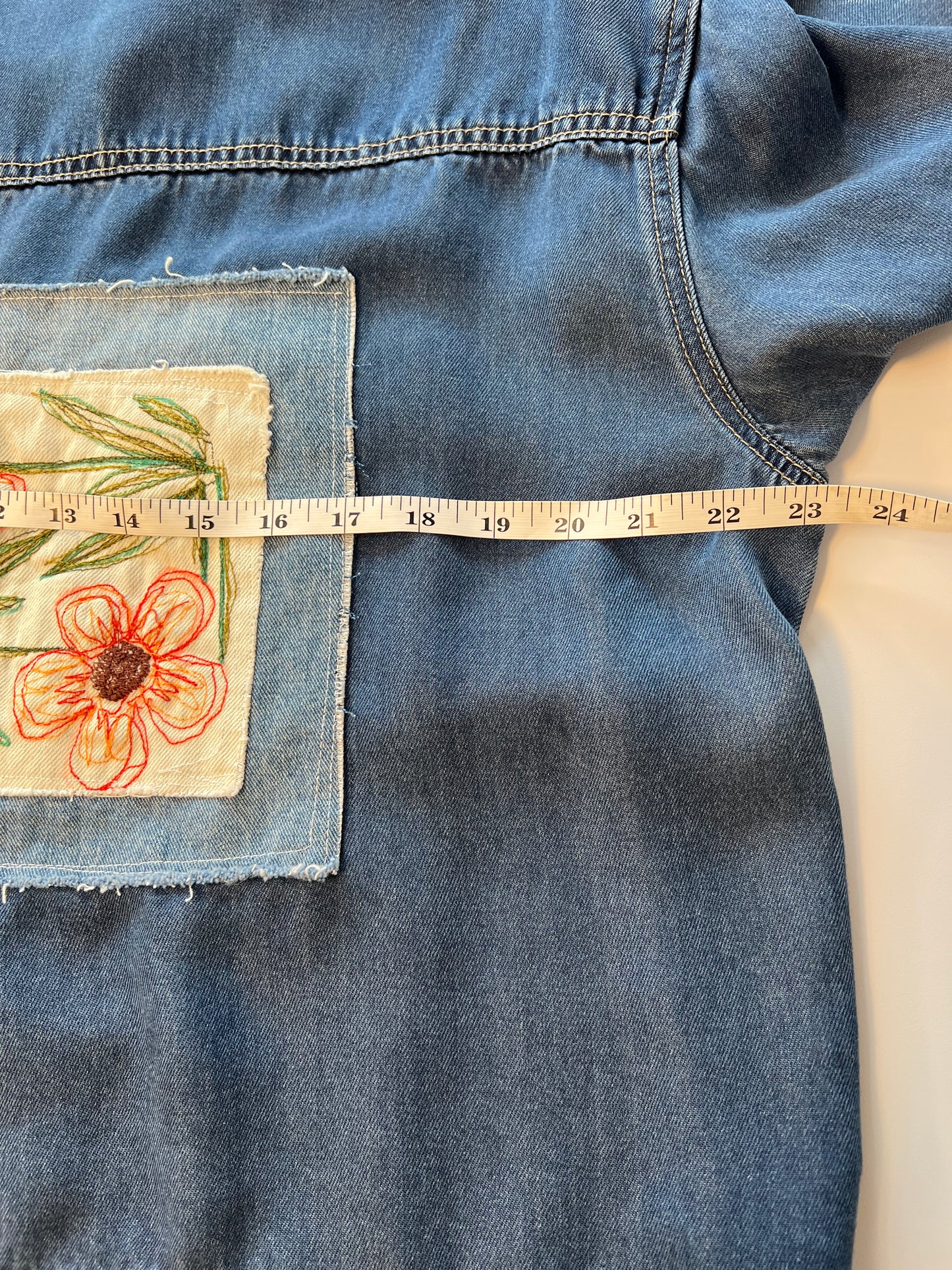 Soft light weight denim with embroidered floral patch