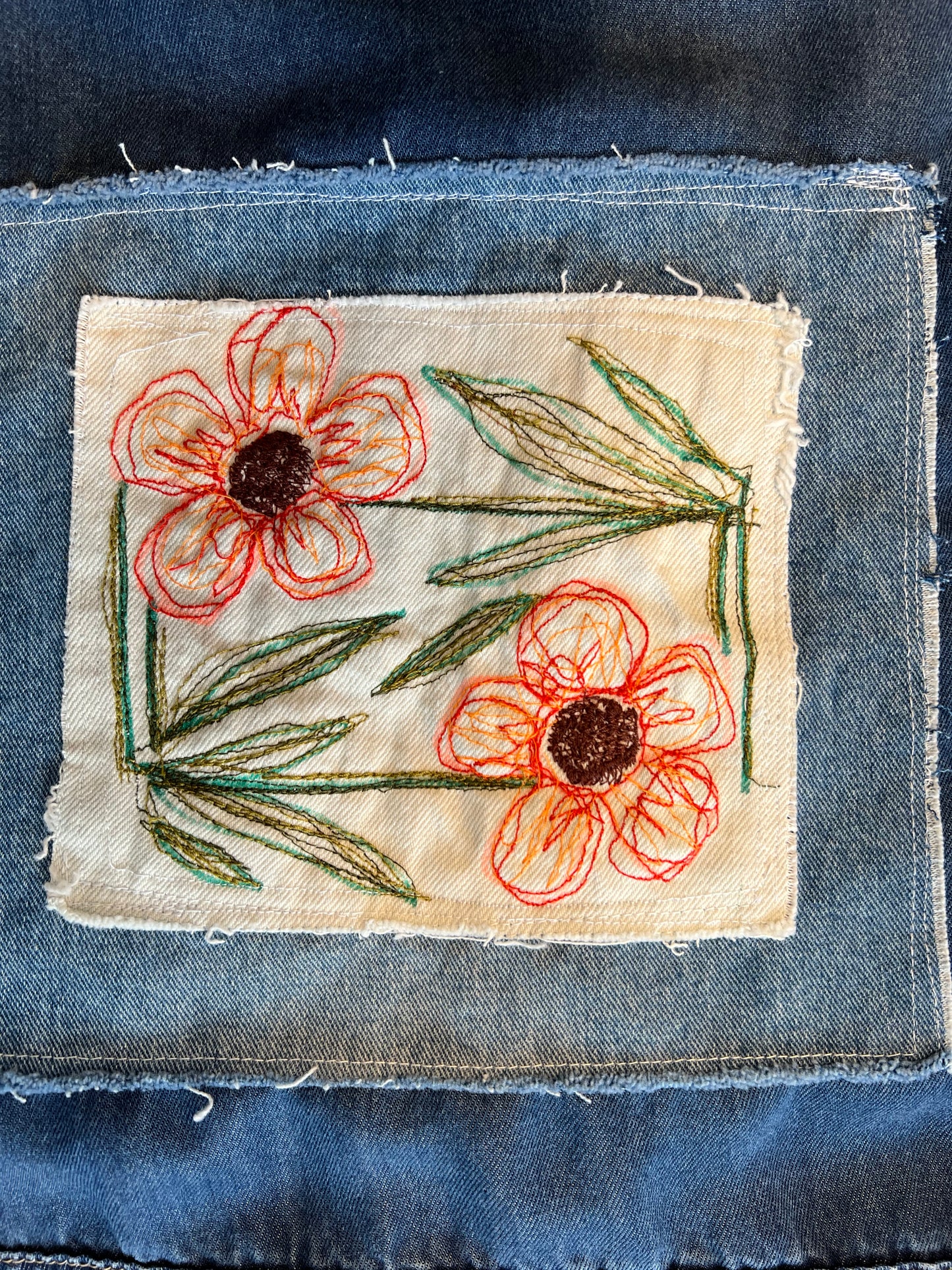 Soft light weight denim with embroidered floral patch