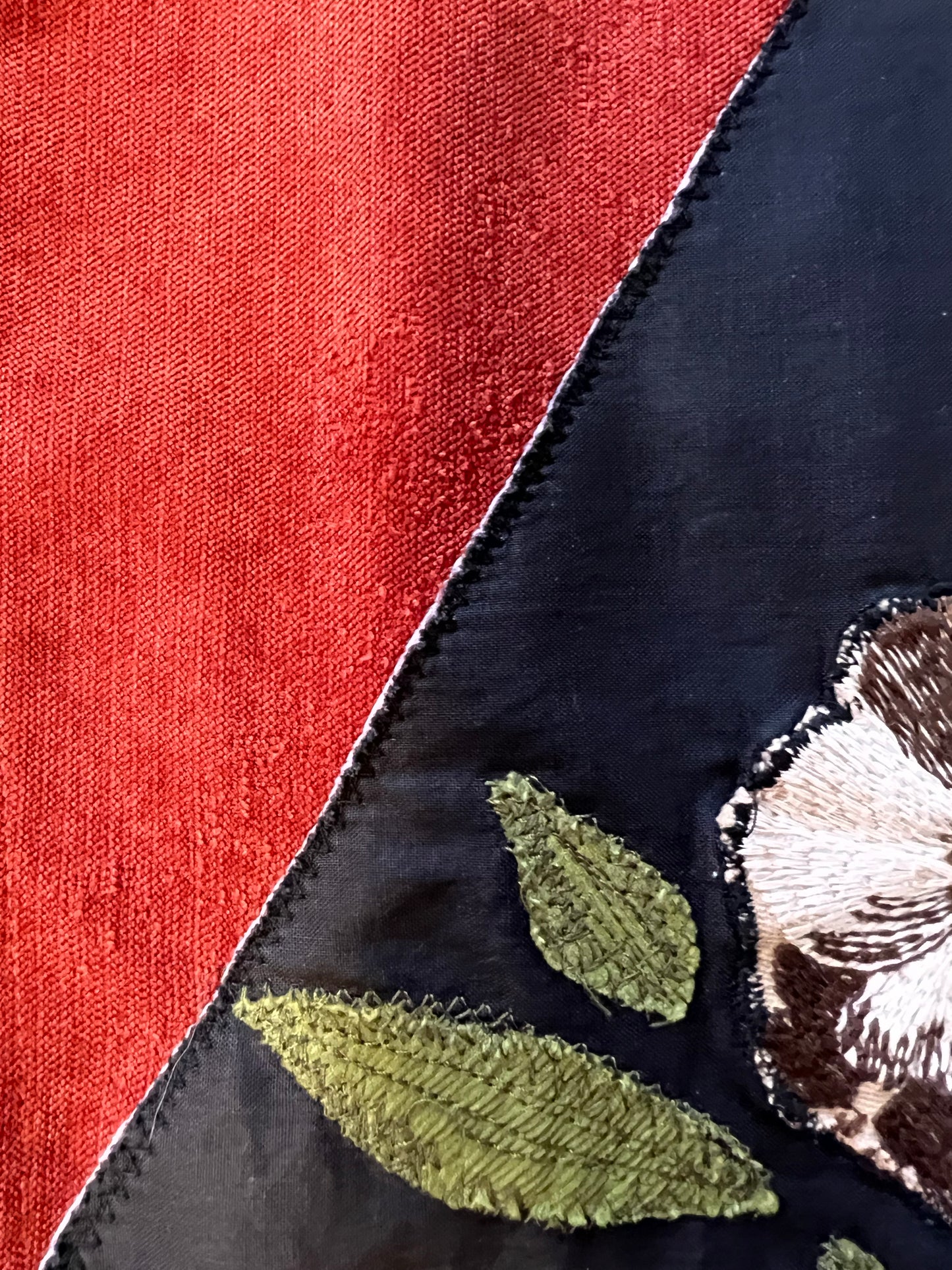 Burnt red jacket with floral patch