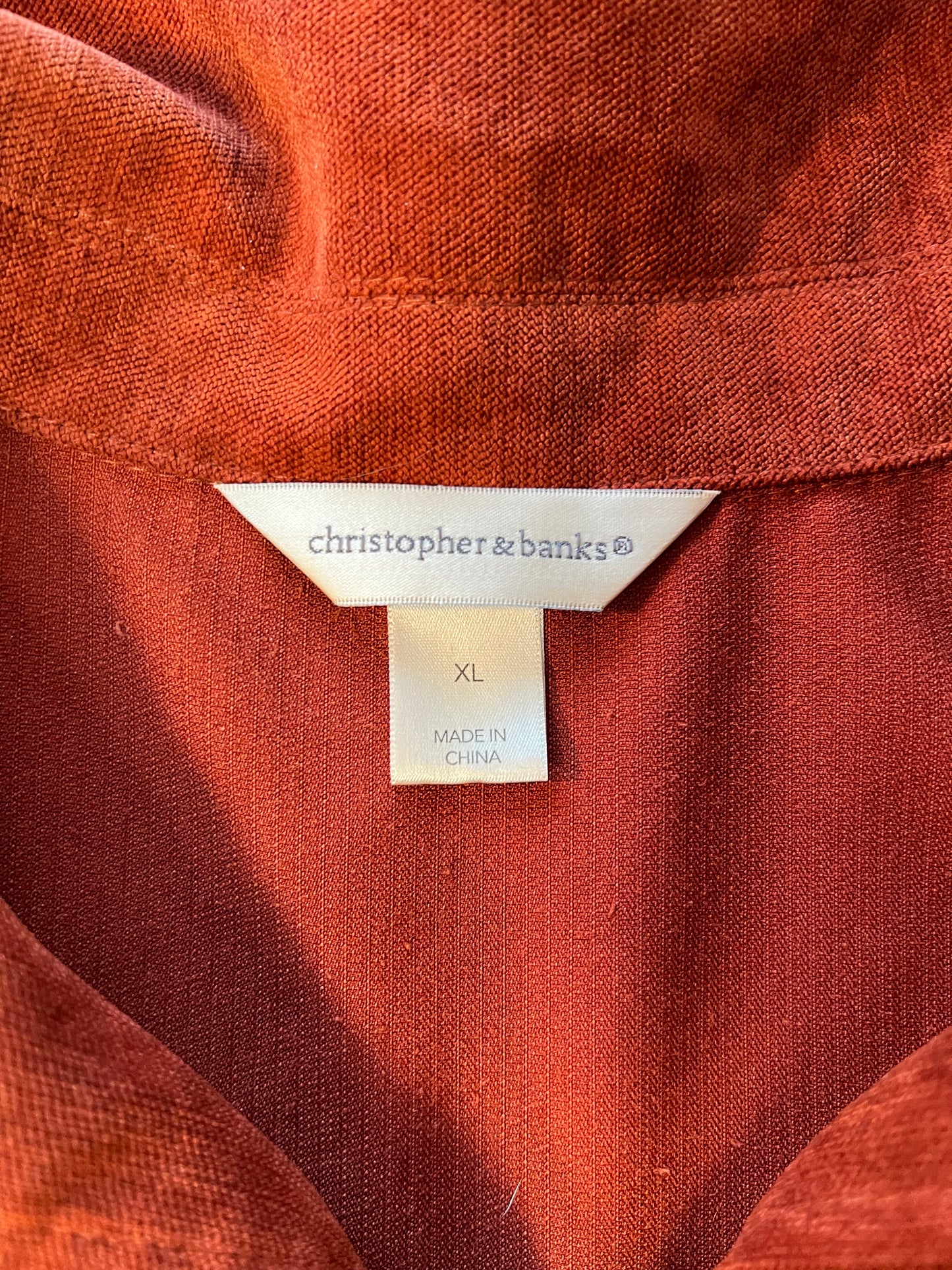 Burnt red jacket with floral patch