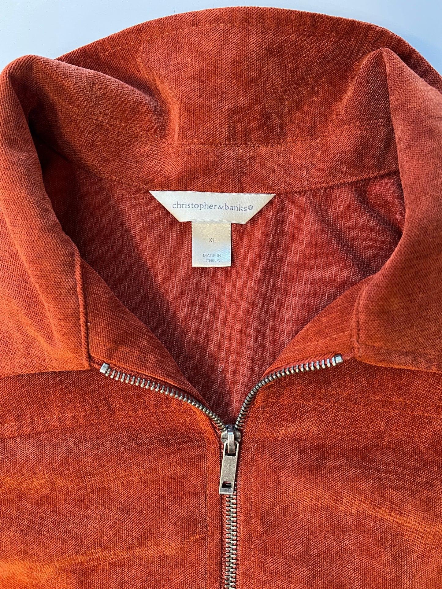 Burnt red jacket with floral patch