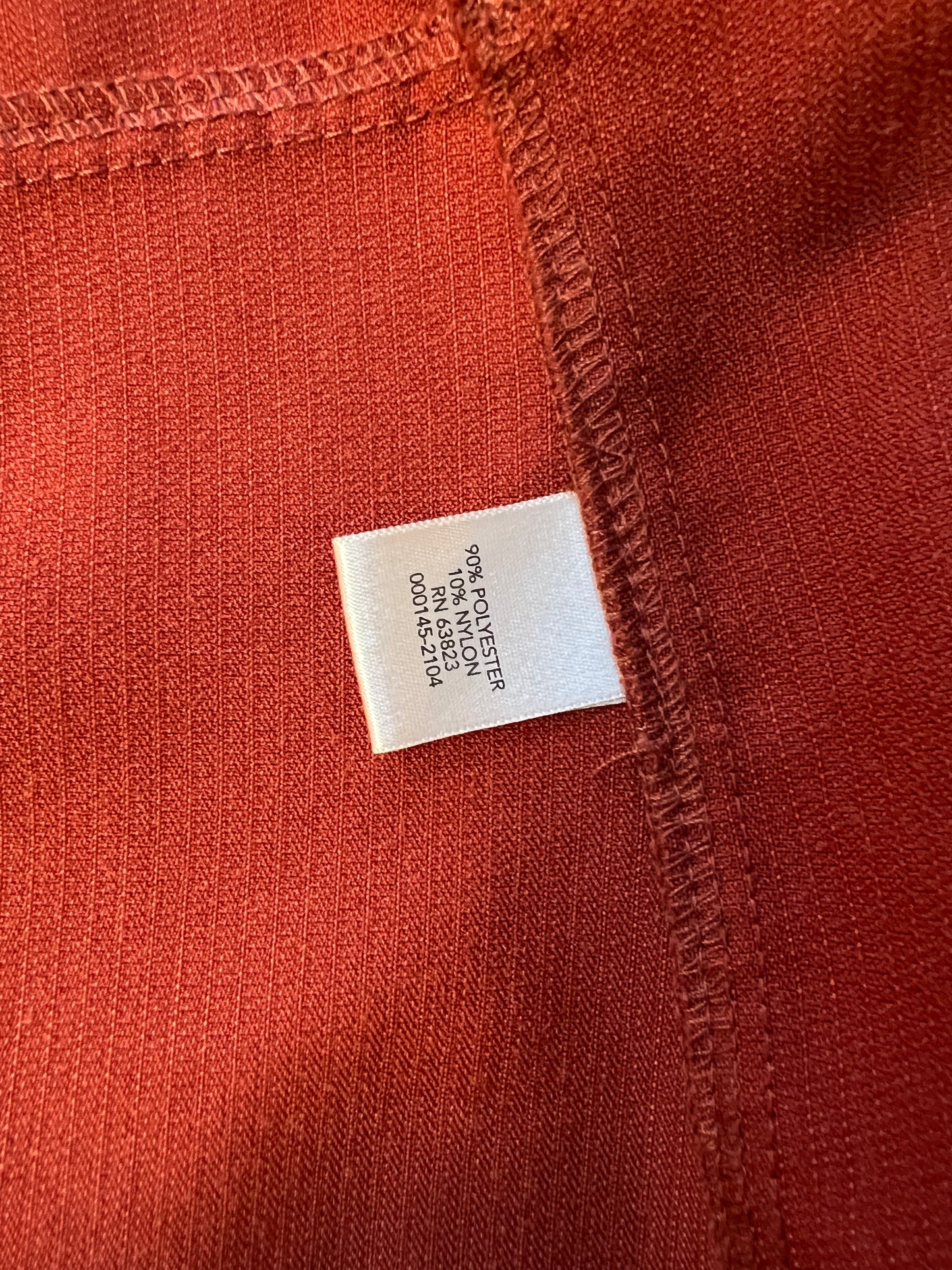 Burnt red jacket with floral patch