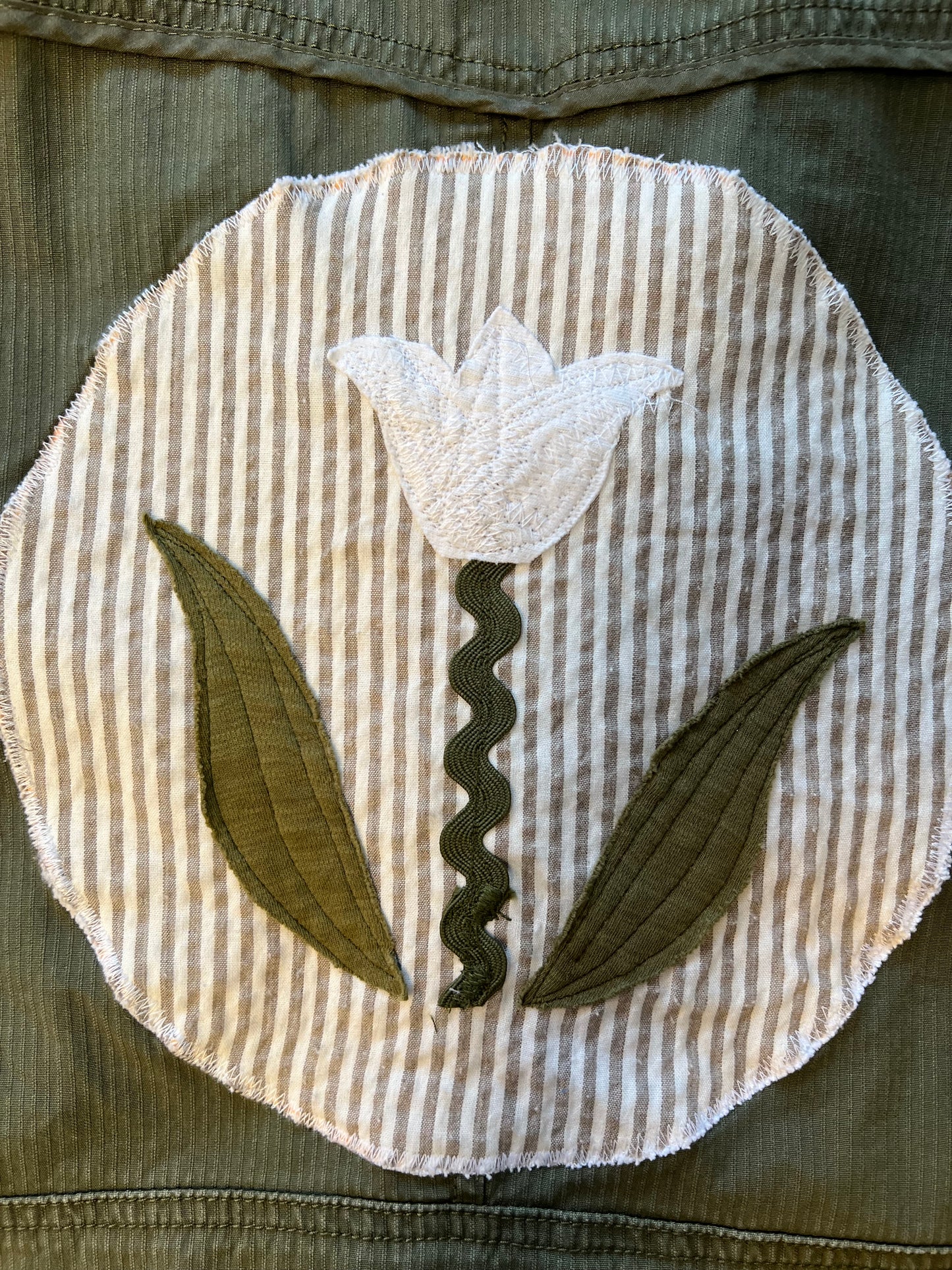 Green jacket with Rick Rack patch