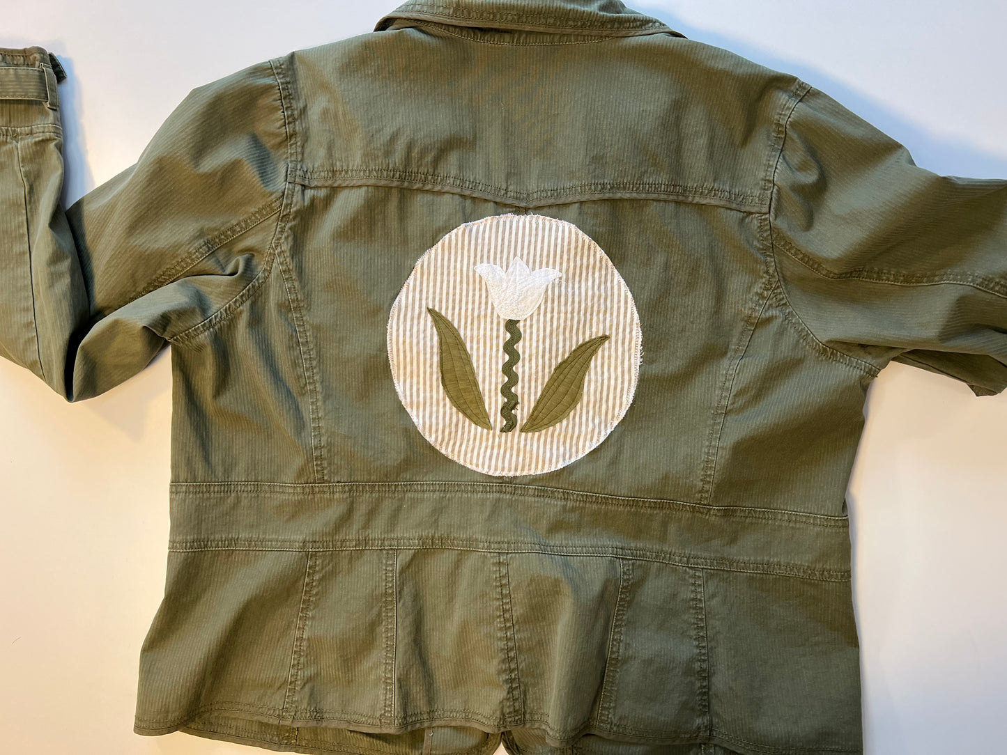 Green jacket with Rick Rack patch